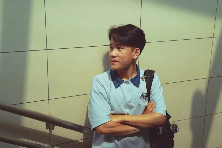 Traveler with a backpack standing beside an indoor railing