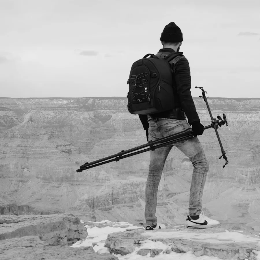 Hiking poles packed for air travel next to a suitcase