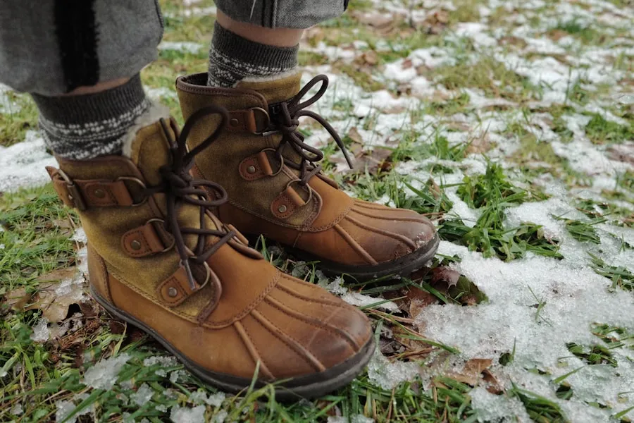 Hiking boots prepared with gaiters and winter traction for snow use