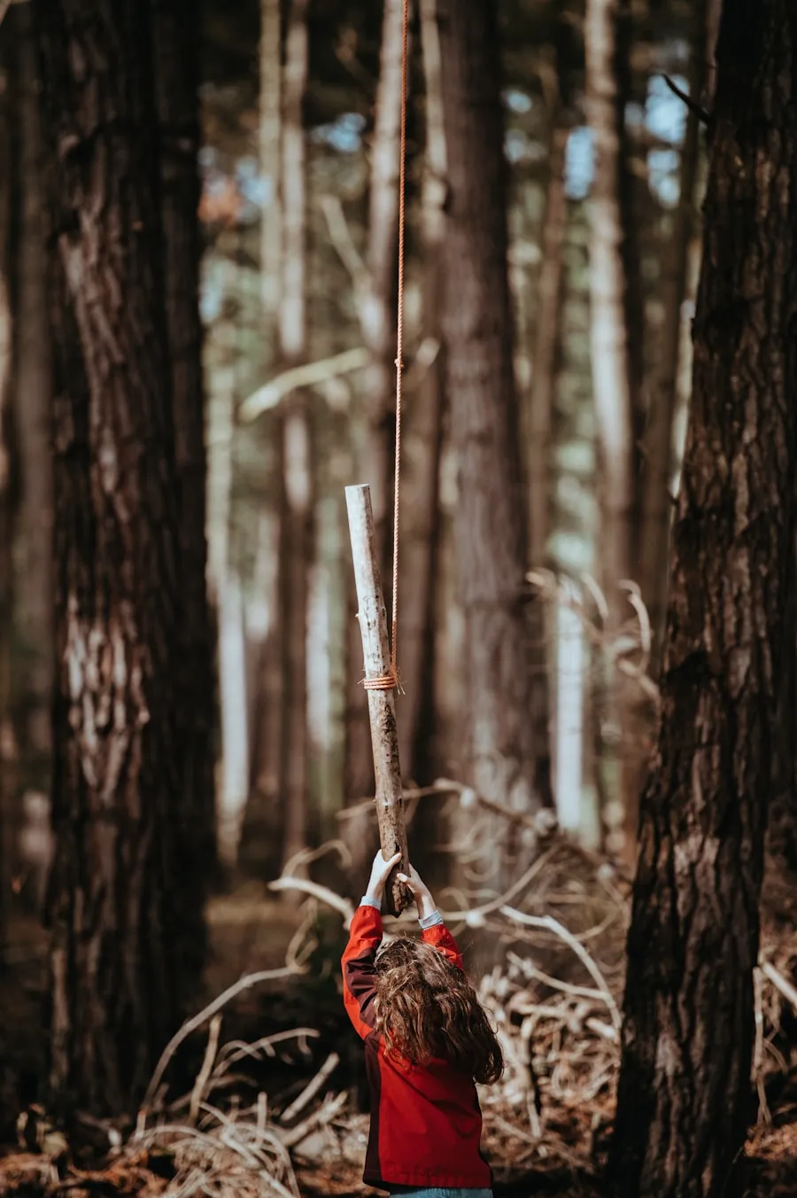 Close-up of a finished wooden hiking staff handle showing smooth oiled wood grain