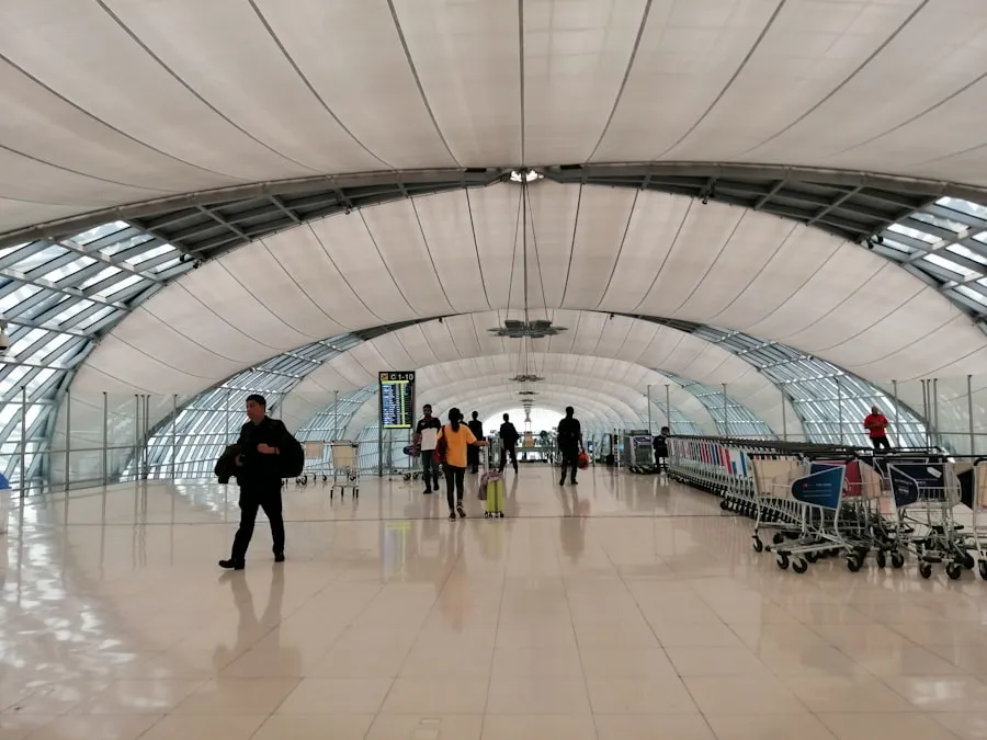 Travelers walking through a modern airport concourse