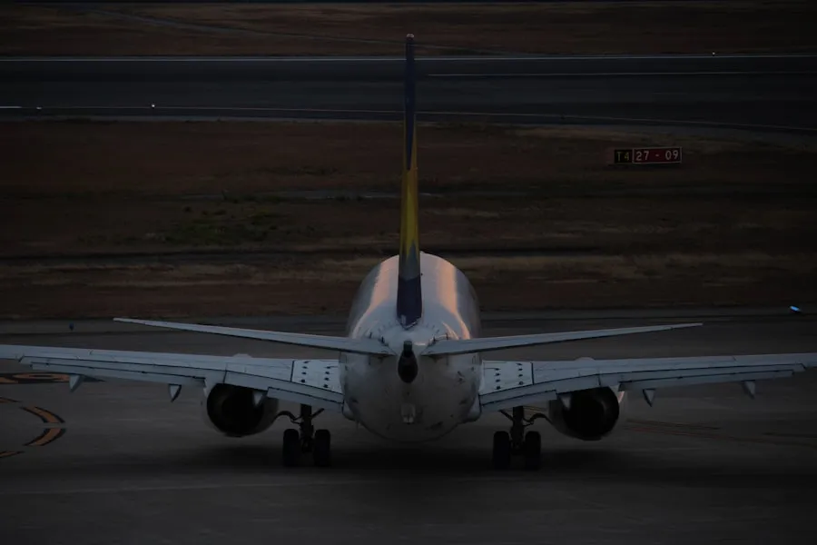 Commercial passenger aircraft taxiing at dusk