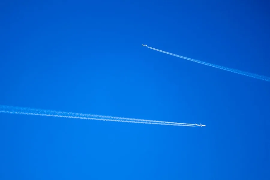 Discover Gainesville: Airlines Serving GNV Two passenger aircraft leaving contrails in a clear blue sky