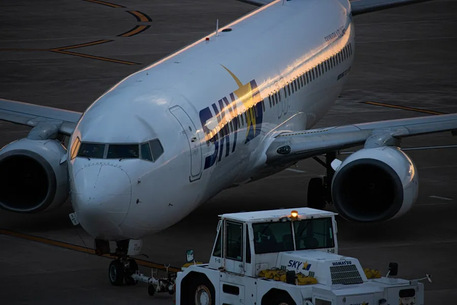 Commercial passenger jet being towed on an airport apron