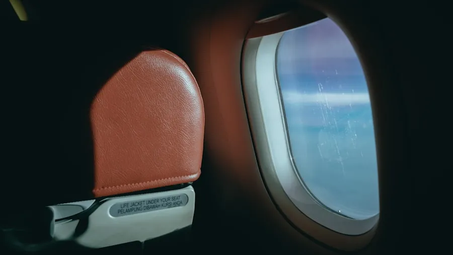Passenger seated in a Southwest Airlines economy seat showing the available seat width