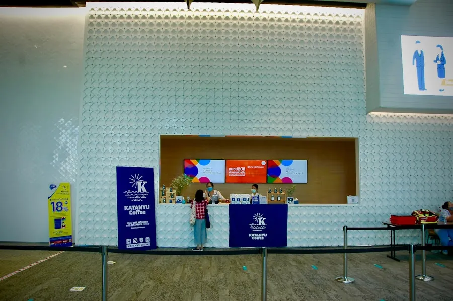 Traveler holding a passport and boarding pass securely at the airport