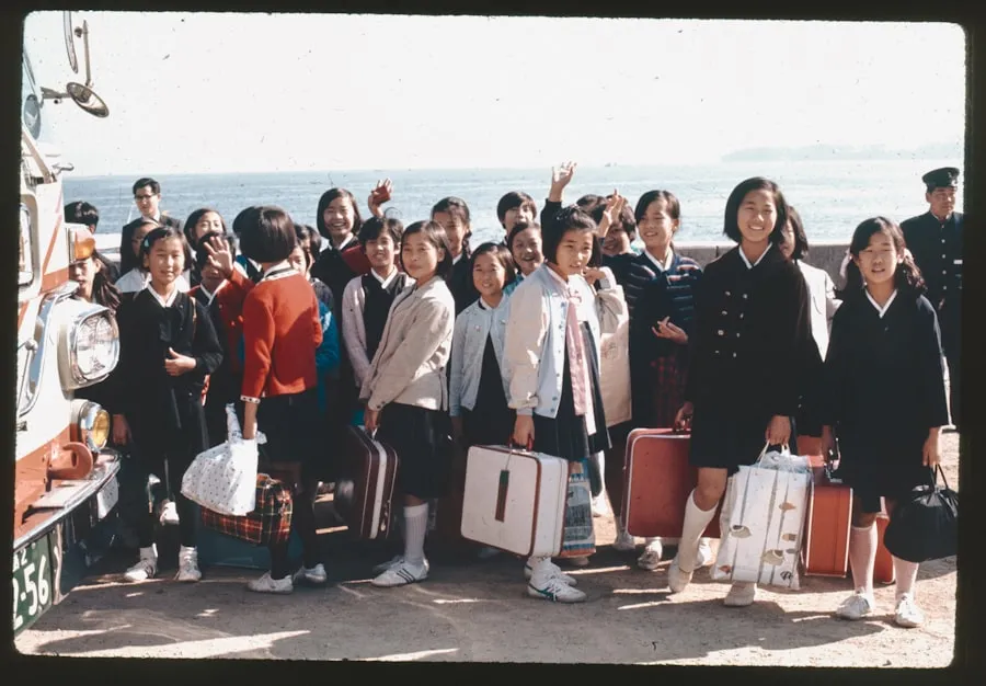 American Airlines: Streamlining Boarding with 9 Groups Group of young travelers standing with suitcases beside a bus