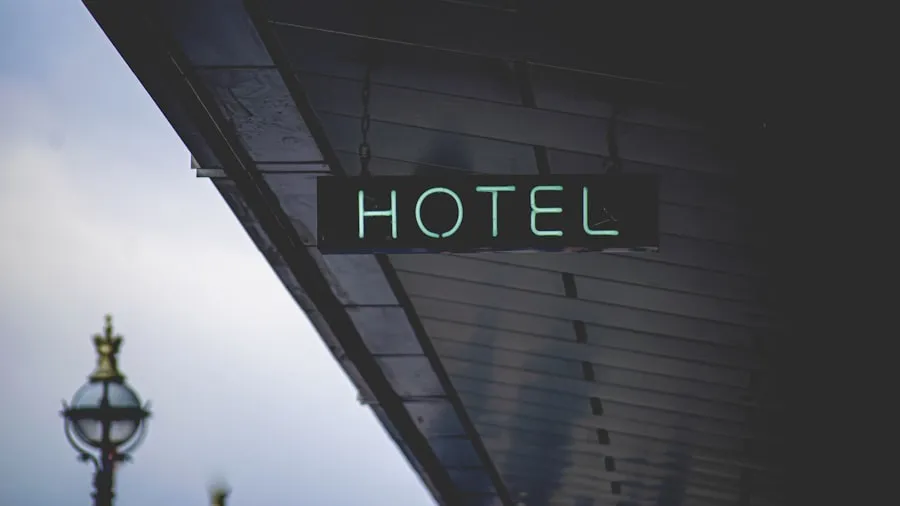 Traveler arriving at a hotel reception desk at night (illustrative)