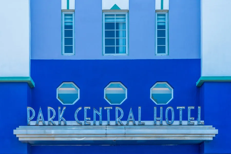 Extended stay hotel exterior with parking and outdoor seating