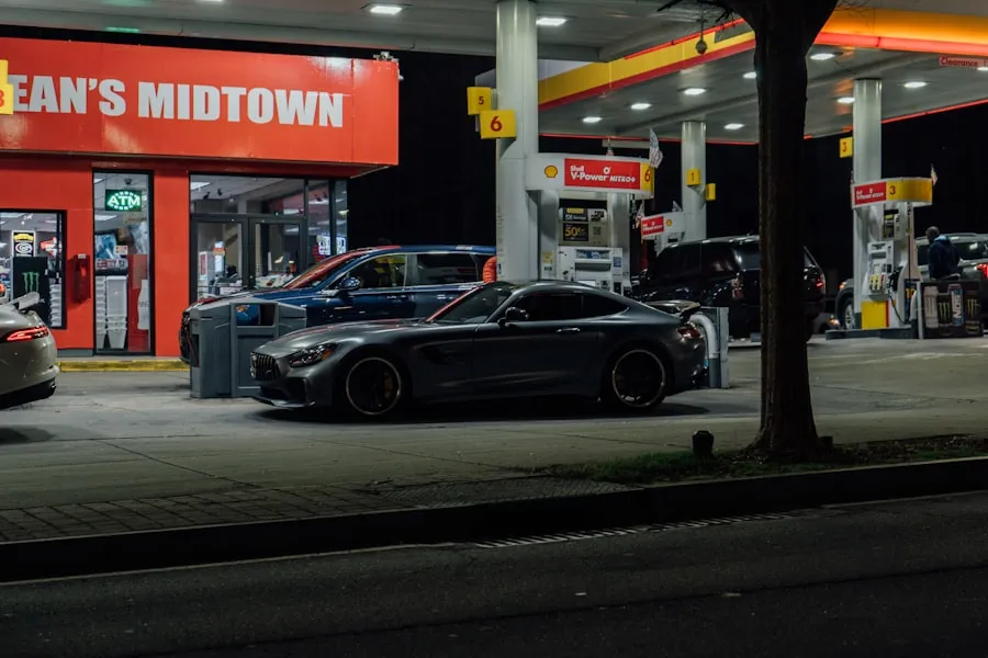 Radisson Hotels: Owned by Jin Jiang International Cars parked at a Shell gas station at night