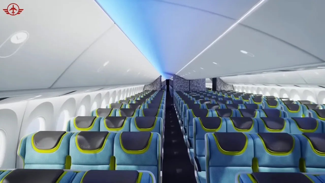 Wide Boeing 777X economy cabin concept with blue ceiling lighting and turquoise seats