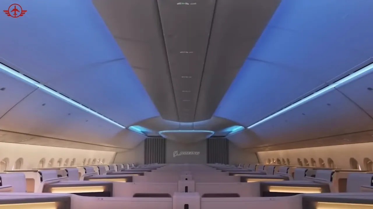 Boeing 777X cabin concept with blue ceiling lighting and warm sidewall illumination