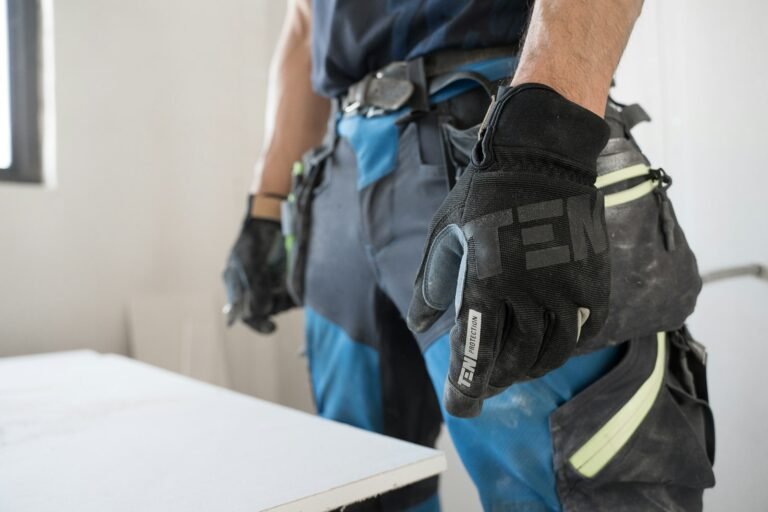 Best Tactical Gloves Hands wearing black and gray tactical work gloves